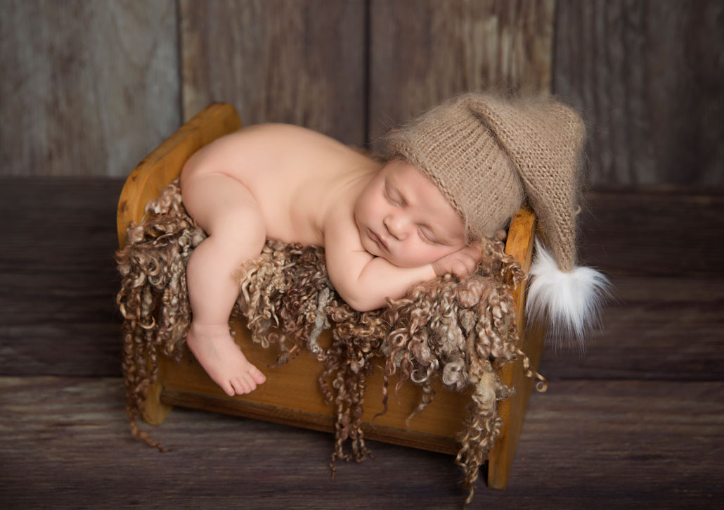 newborn photography ipswich baby sleeping bed with sleepy hat newborn photography ipswich baby sleeping bed with sleepy hat